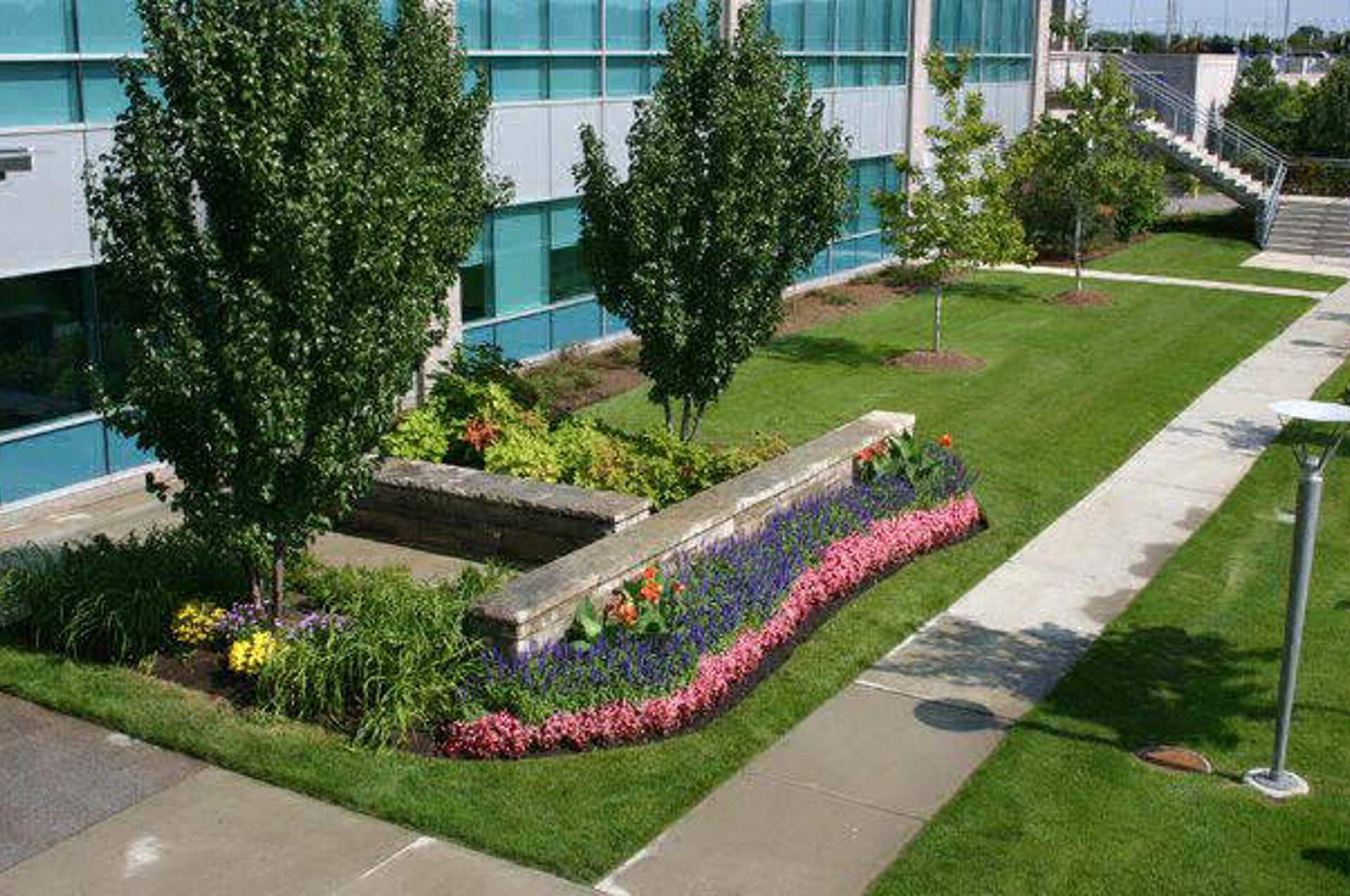 Crew mowing commercial property lawn